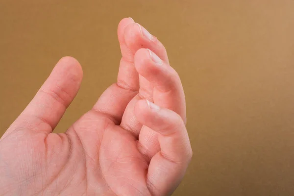 Mano Haciendo Gesto Sobre Fondo Madera — Foto de Stock