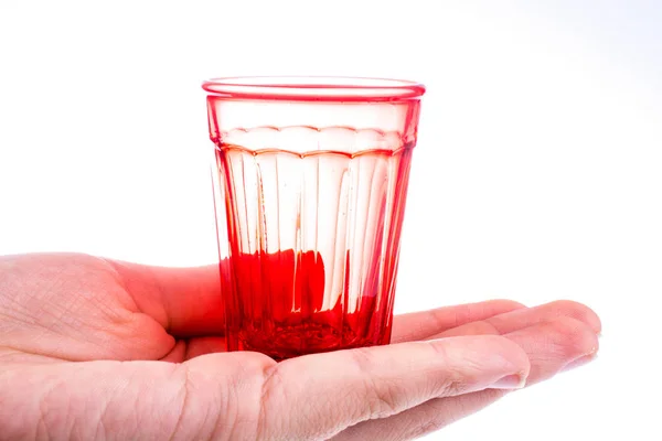 Person Holding Colorful Empty Drinking Glass White Background — 스톡 사진