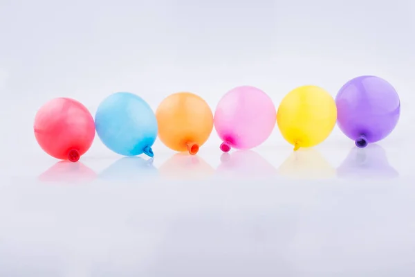 Colorful Small Balloons Line White Background — Stock Photo, Image