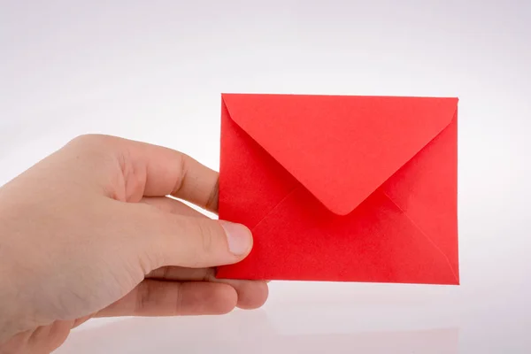 Hand Met Een Rode Envelop Wit — Stockfoto