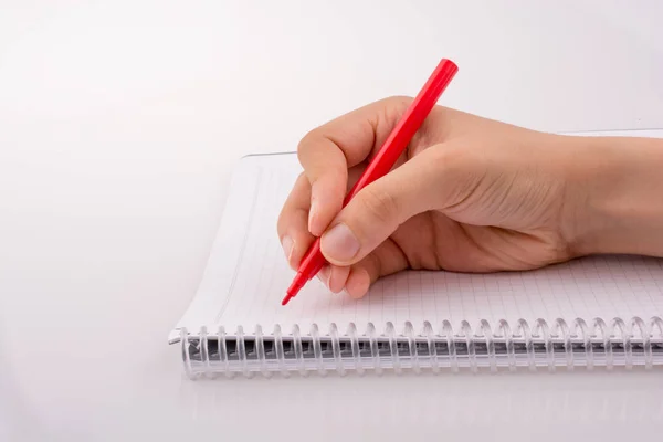 Escritura Mano Cuaderno Con Bolígrafo Sobre Fondo Blanco — Foto de Stock