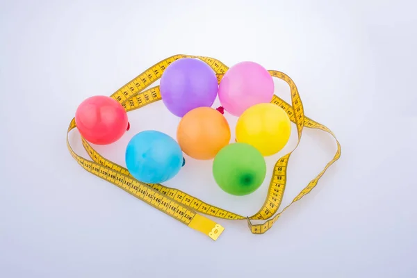 Colorful Balloons Surrounded Measuring Tape Happy Celebration Party Background — Stock Photo, Image