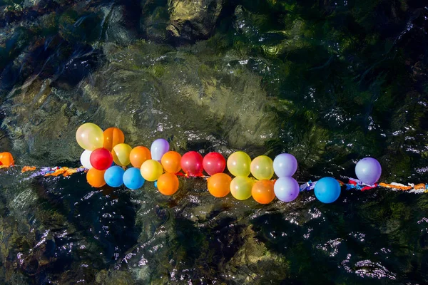 Balloons in shooting range as targets on water