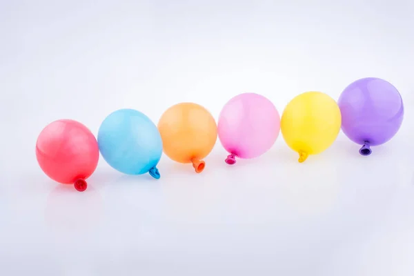 Colorful Small Balloons Line White Background — Stock Photo, Image