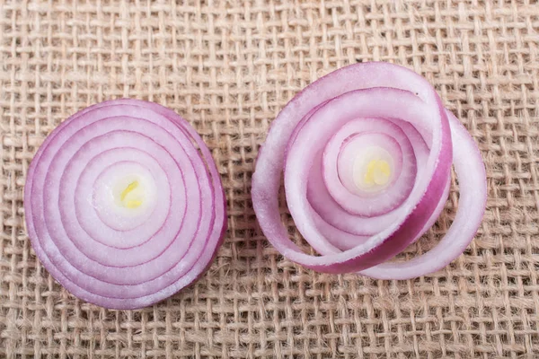Sliced onion rings and  onion slices  on the background