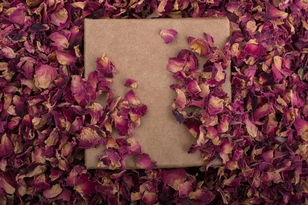 Dried  rose petals in box and as a background