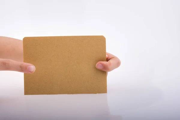 Hand Holding Sheet Paper White Background — Stock Photo, Image