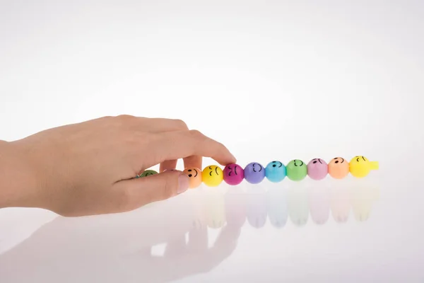 Hand Holding Color Beads Facial Expression White Background — Stock Photo, Image