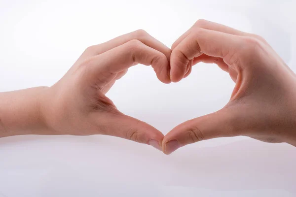 Hand Waardoor Vorm Van Een Hart Een Witte Achtergrond — Stockfoto