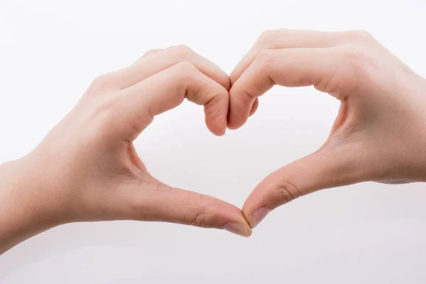 Hand Waardoor Vorm Van Een Hart Een Witte Achtergrond — Stockfoto