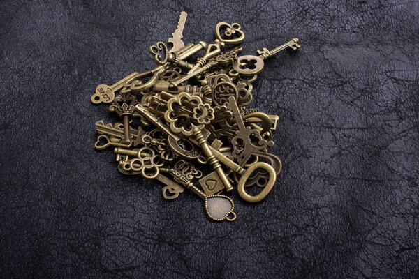 Retro style metal keys on a black background