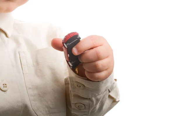 Baby hand holding a red car — Stock Photo, Image