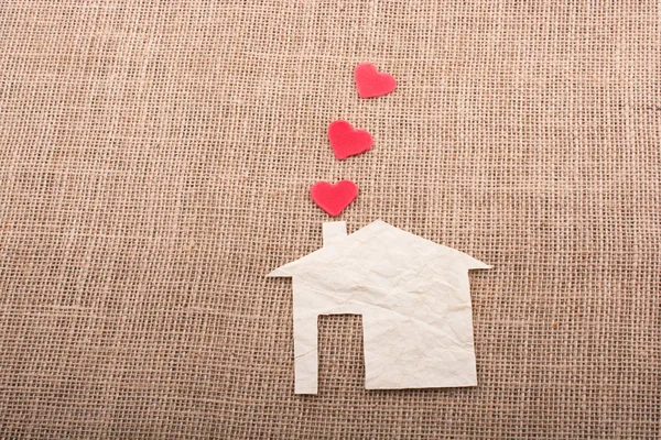 Hearts coming out of chimney of paper house — Stock Photo, Image