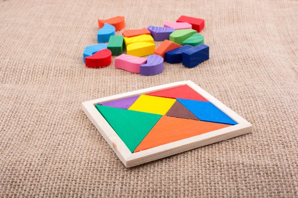 Stukjes van een vierkante tangram puzzel — Stockfoto