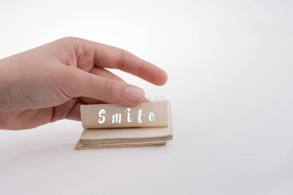 Testo sorriso su un taccuino in mano — Foto Stock