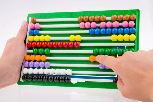 Hand using an abacus — Stock Photo, Image