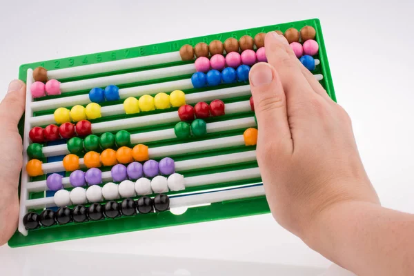 Hand using an abacus — Stock Photo, Image