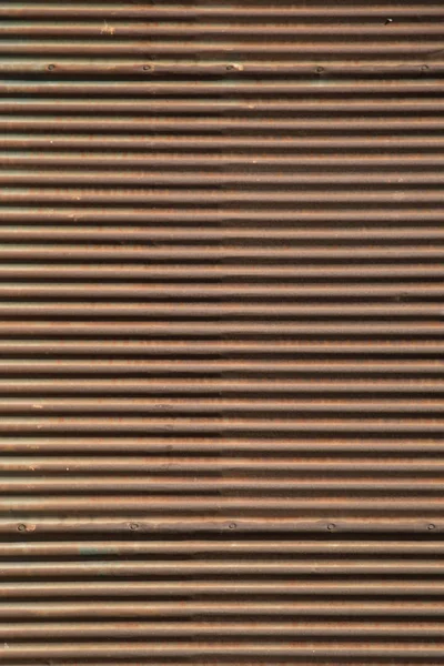 Straight lines on a shop front shutter as a background