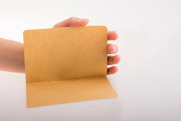 Hand holding a paper — Stock Photo, Image