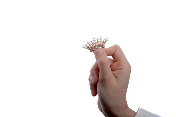 Golden color crown with pearls in hand — Stock Photo, Image