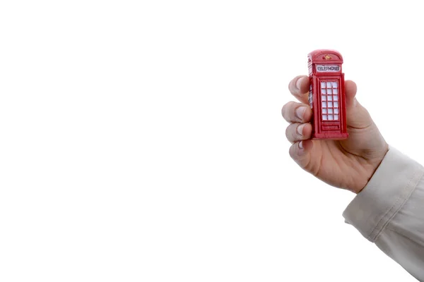 Telefon w ręku stoisko — Zdjęcie stockowe