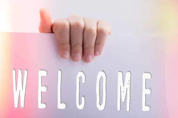Hand holding paper with welcome wording — Stock Photo, Image