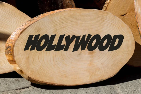Small piece of cut wood logs with HOLLYWOOD word