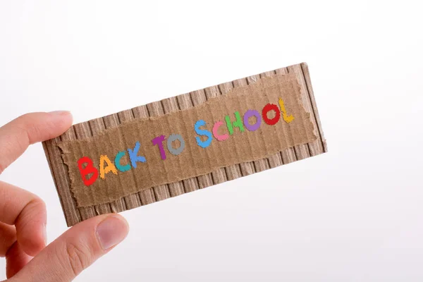 Hand holding a cut carton — Stock Photo, Image