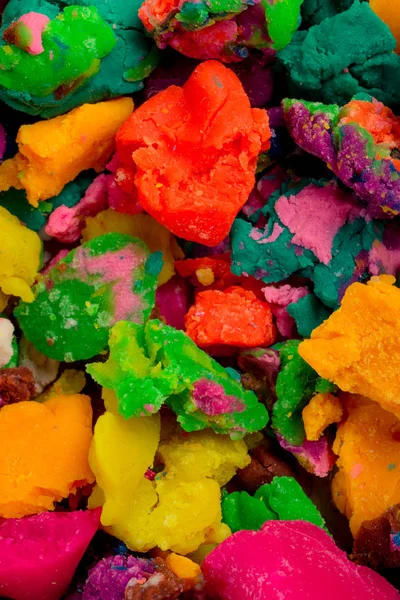Dry colorful play dough in pieces