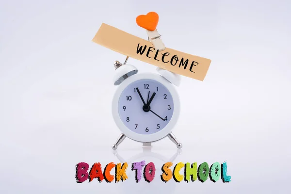 The  title back to school and an alarm clock — Stock Photo, Image