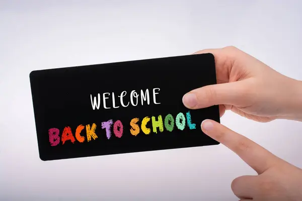 Rectangular shaped black notice board in hand — Stock Photo, Image