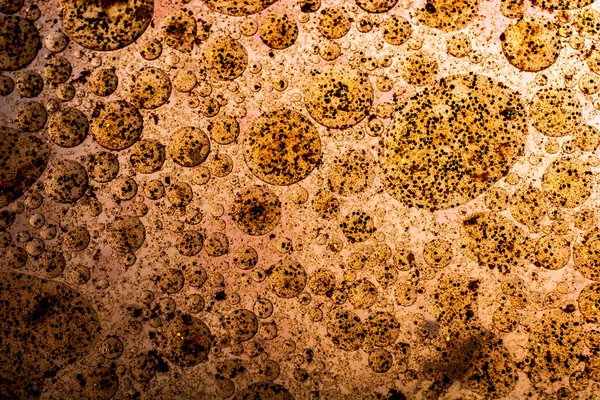 Makroaufnahme von Ölblasen über farbigem Hintergrund — Stockfoto