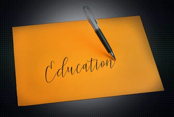 Pen and plain color paper and education wording — Stock Photo, Image