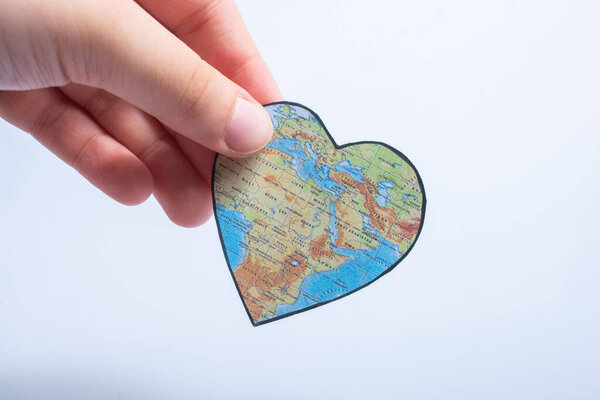 heart shaped object with map of Africa as valentine concept in hand