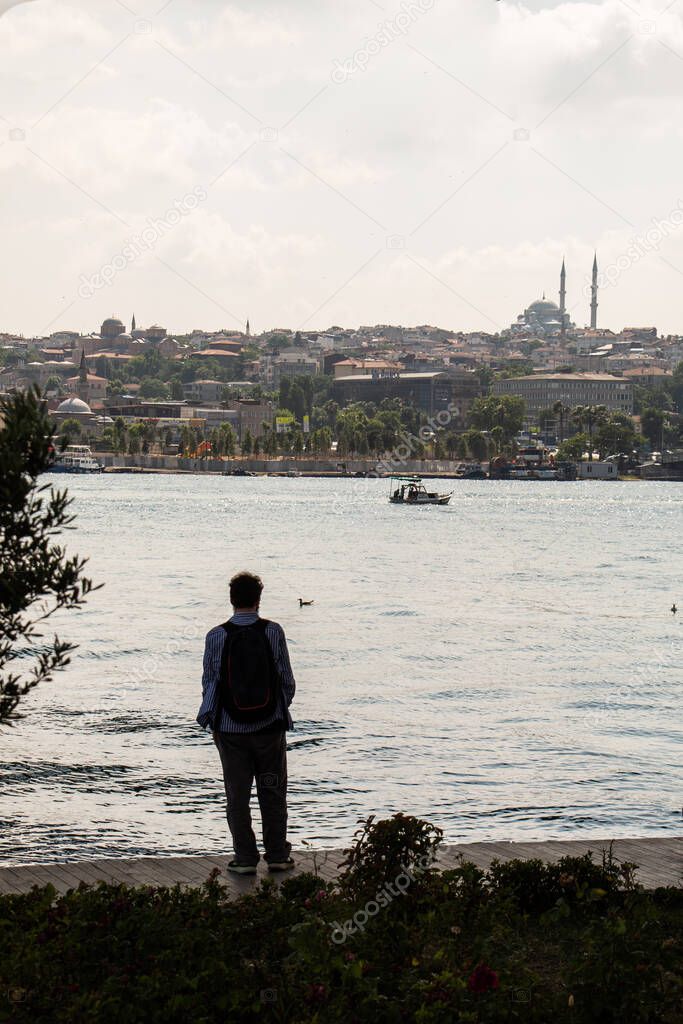 Boy by the sea  in Istanbul as  favorite destination