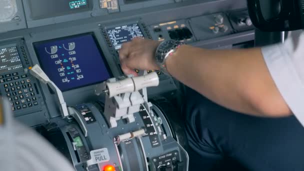 Close up of pilots hand regulating a flap lever and checking rotating blades — Stock Video