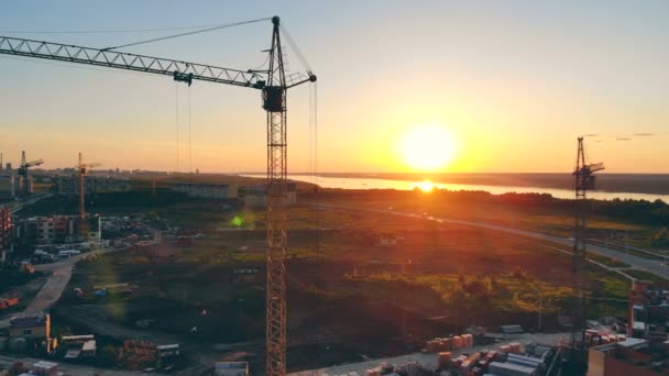 Building construction is near a river on the city outskirts. 4K. — Stock Video