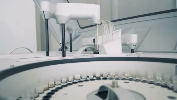 Probes with samples are getting tested by a biochemical analyzer — Stock Video