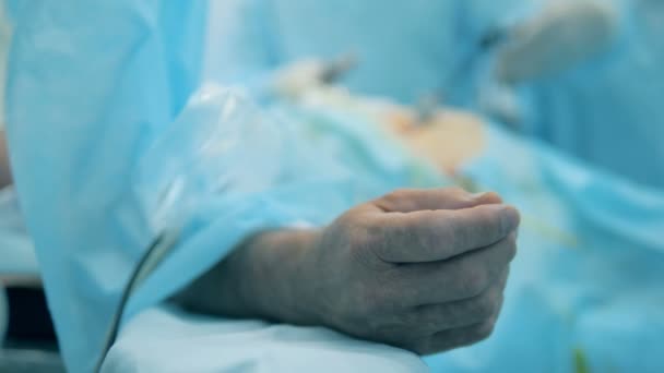 Hand of a patient who is undergoing surgical procedure in a close up — Stock Video