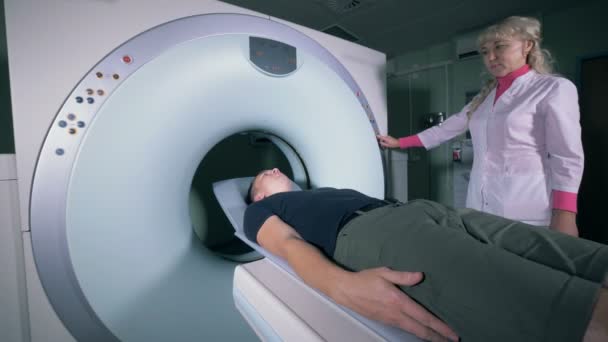 Tomographic scanning on a patient, close up. — Stock Video