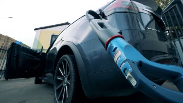 A modern electric car charging, bottom view. — Stock Video