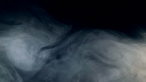 Puffs of mist are dissolving in darkness — Stock Video