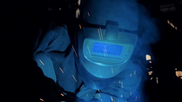 Welder in protective uniform works, close up. — Stock Video