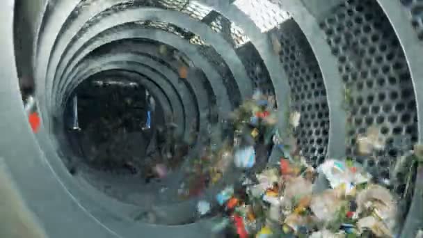 Trash rotates in a machine, close up. — Stock Video