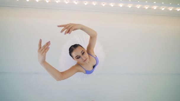 Top view of a lady ballet dancer spinning round — Stock Video