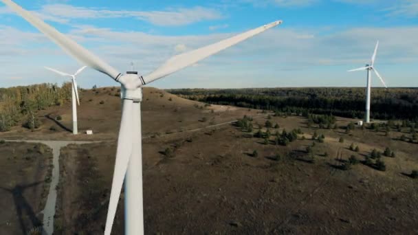 Turbines work on a field, producing power from a wind. 4K. — Stock Video