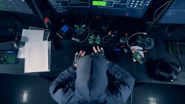 Man types on a keyboard while cracking system, top view. Cybercrime concept. — Stock Video