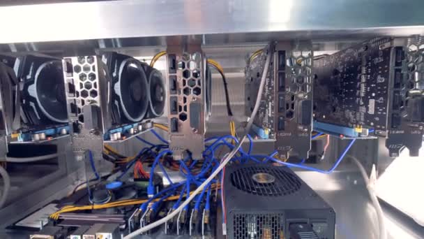 Device for mining crypto currency. GPU in a row ina bitcoin mining farm. — Stock Video