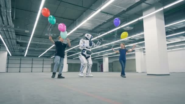 Two Kids Balloons Walking Robot — Stock Video