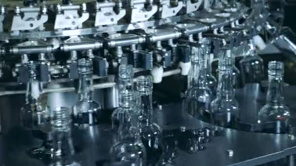 Plant equipment works, bottles washed on a conveyor. — Stock Video